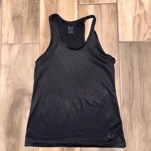 Nike Black Racerback Tank size Medium. A bit worn but still has more life!🖤